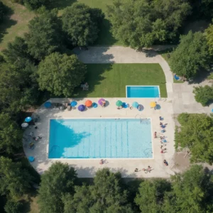 Aerial view of Codorus State Park Pool filled with happy swimmers. - Parksguidance Official